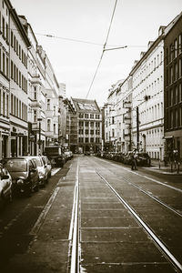 Cars parked on road in city