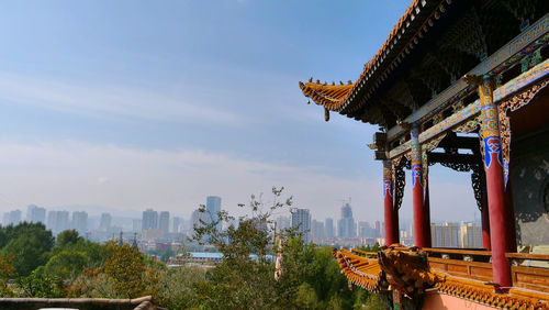 View of city buildings against sky