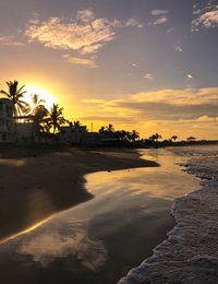 Scenic view of beach against sky during sunset