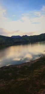 Scenic view of lake against sky during sunset