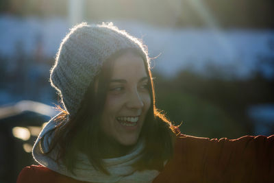 Portrait of smiling young woman outdoors