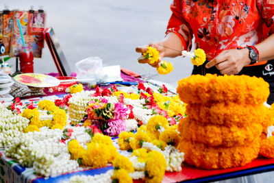 Various flowers for sale at market stall