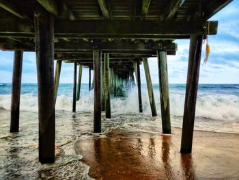 Scenic view of pier over sea against sky