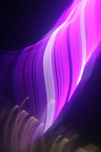 Close-up of light painting against black background