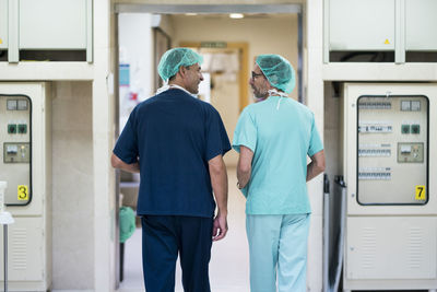 Two surgeons talking in hospital