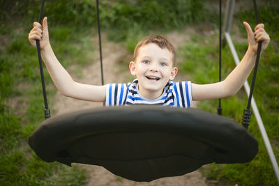 Portrait of boy playing in playground