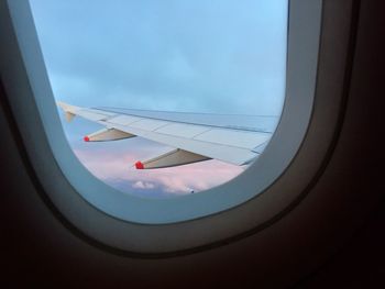 Airplane wing seen through window