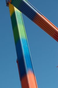 Low angle view of bridge against clear blue sky