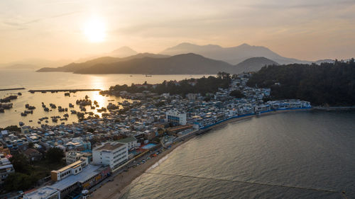 High angle view of harbor and buildings in city