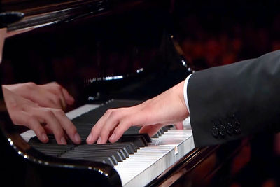 Cropped image of man playing piano