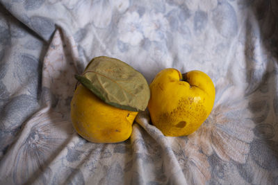 High angle view of yellow fruit on bed