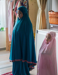 Muslim children praying at home. learning to pray for the little girl. happy and jovial child.