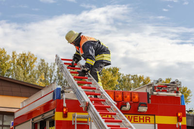 Low angle view of firefighter working