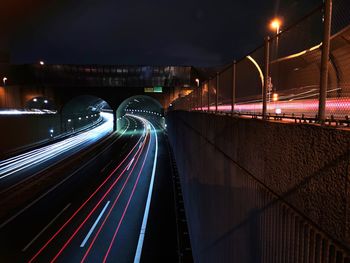 High angle view of light trails on road at night