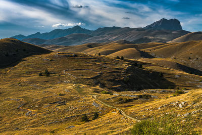 Aerial view of mountain range against sky