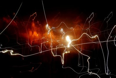 Close-up of fireworks against sky at night