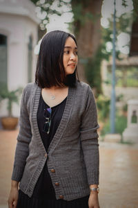 Young woman standing in city