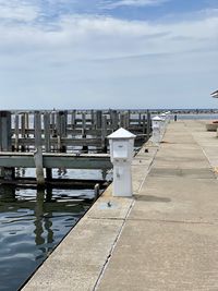 Pier over sea against sky