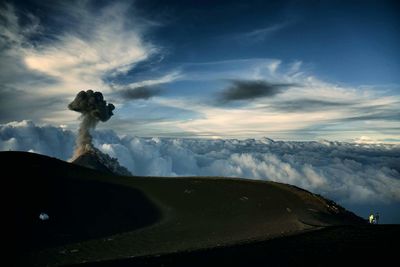 Scenic view of volcanic landscape against sky during sunset