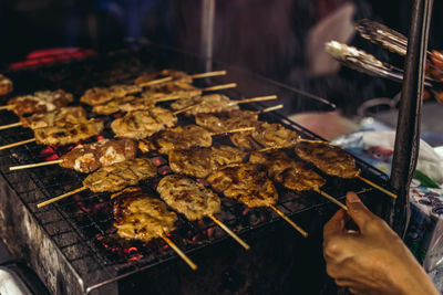 High angle view of meat on barbecue grill