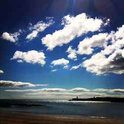 Scenic view of sea against cloudy sky