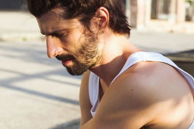 Side view of shirtless man in water