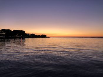 Scenic view of sea against clear sky at sunset