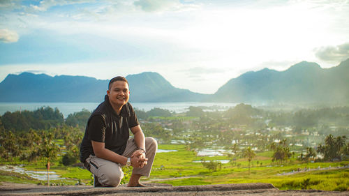 Portrait of man standing on mountain