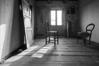 Empty chair in abandoned building