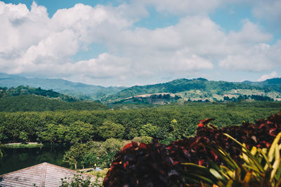 Scenic view of landscape and mountains against sky