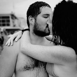 Close-up of couple kissing outdoors