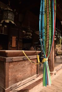 Low angle view of multi colored flags hanging by building