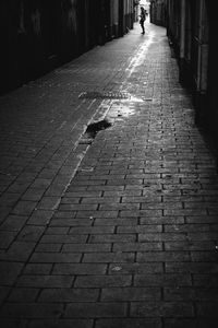 Low section of man walking on street