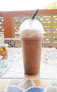 Glass of coffee on table