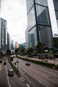 City street and modern buildings against sky