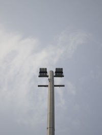 Low angle view of communications tower against sky