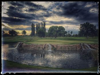 Scenic view of landscape against cloudy sky