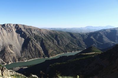 Scenic view of mountains against clear blue sky at firat river