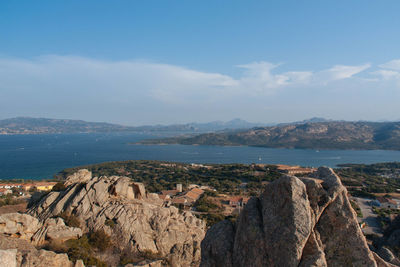 Panoramic view of sea and mountains against sky