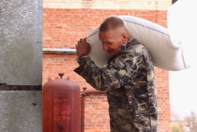 High angle view of man standing in front of building
