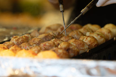 Close-up of hand holding meat at market