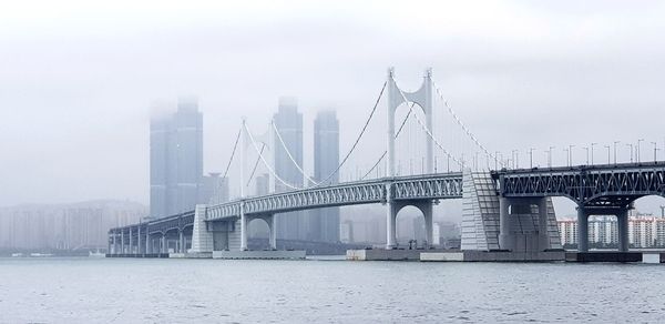 View of suspension bridge in foggy weather