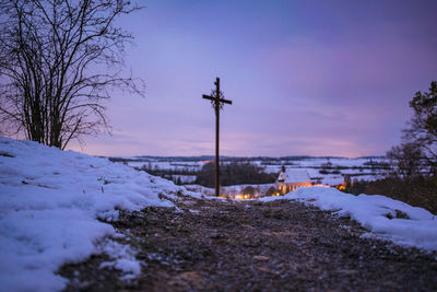 Snow covered field against sky