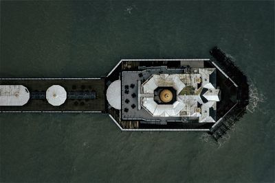 Aerial view of built structure on pier amidst sea