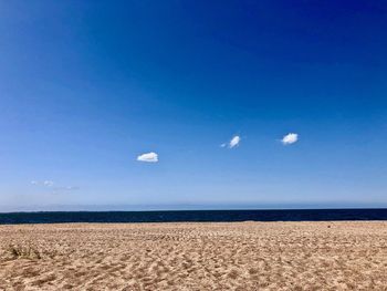 Scenic view of sea against blue sky