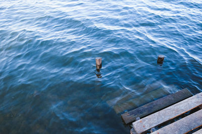 High angle view of wooden stair in sea