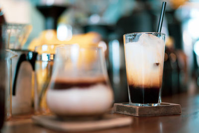Close-up of coffee in glass on table