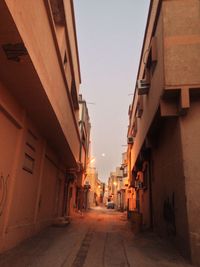 Narrow alley amidst buildings in city