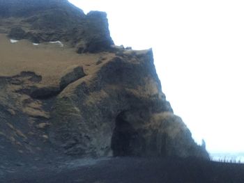 Low angle view of rock formation against clear sky