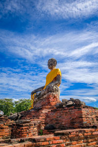 Low angle view of statue against sky